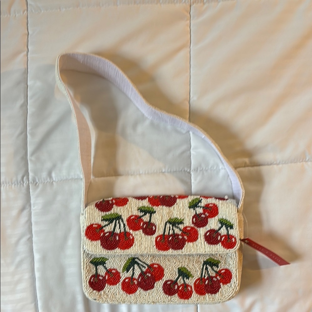 Kelly & Katie Cream and Red Crossbody Bag with Cherry Print